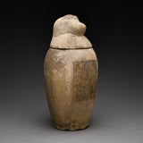 Two Egyptian Limestone Canopic Jars and Two Egyptian Canopic Jar Lids of Hapy