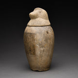 Two Egyptian Limestone Canopic Jars and Two Egyptian Canopic Jar Lids of Hapy