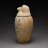 Two Egyptian Limestone Canopic Jars and Two Egyptian Canopic Jar Lids of Hapy