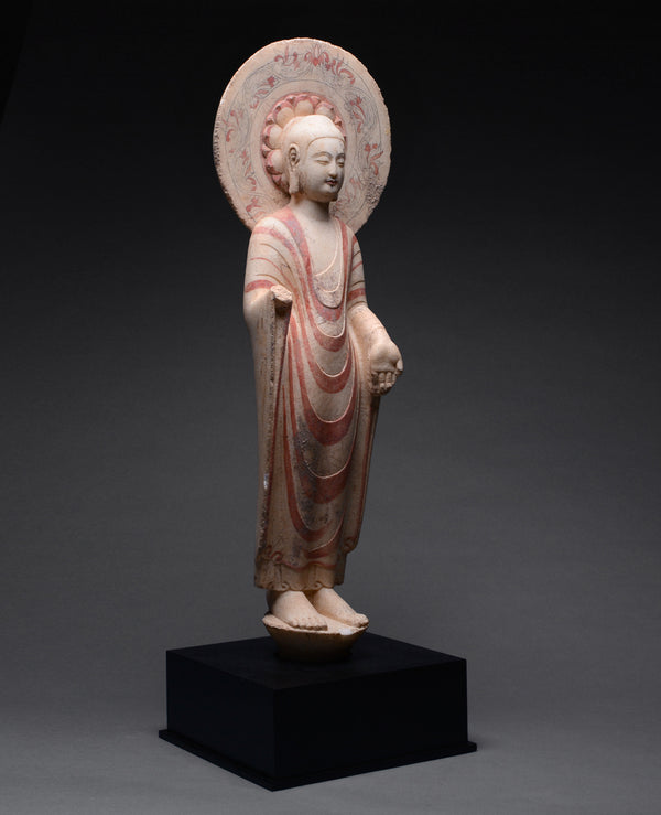 An Important Highly Polychromed Northern Qi Marble Buddha with Halo