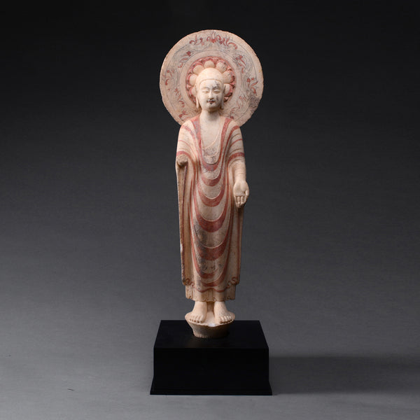 An Important Highly Polychromed Northern Qi Marble Buddha with Halo